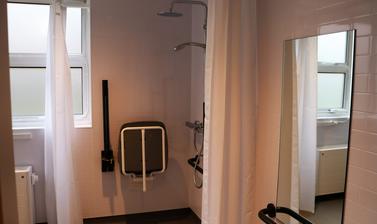 accessible bathroom including shower seat